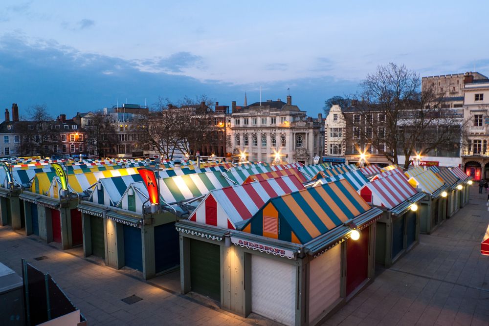 The colorful Norwich market at dusk in Norwich, credits Wirestock