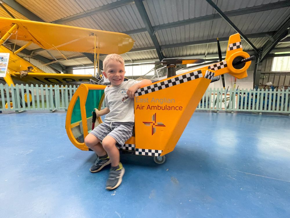 Ben Bertoni in the children's helicopter at the Norfolk and Suffolk Aviation Museum in Bungay