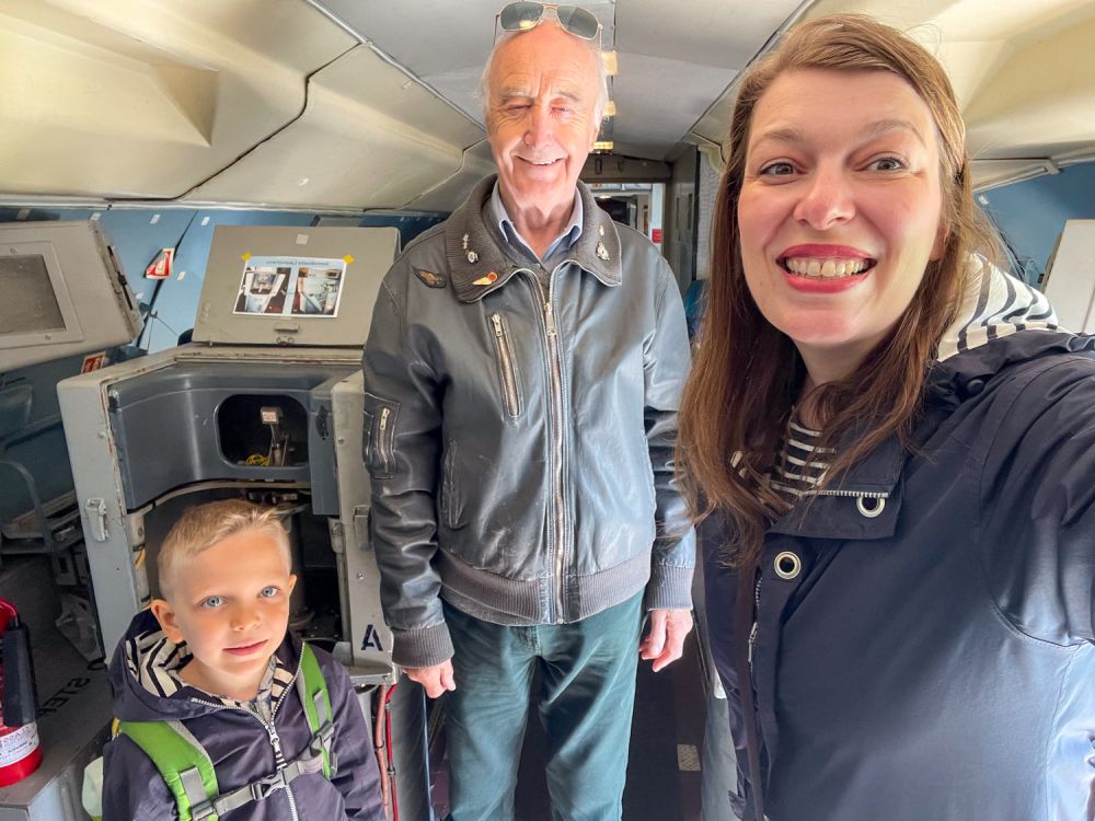 Paola and Ben Bertoni with a volunteer guide inside the Hawker Siddeley Nimrod plane at the City of Norwich Aviation Museum